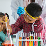 Child experimenting with Test Tubes